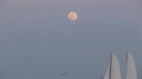 Florida Full Moon at Sunset with Sailboat and Shoreline Stock Footage 5333791