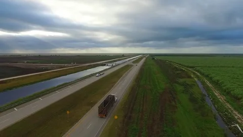 Florida Sugarcane Fields and Sugarcane Truck on Highway Stock Footage 74314946