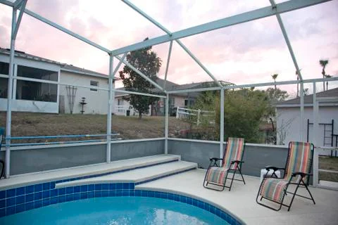 Florida sun set back yard pool Stock-Fotos
