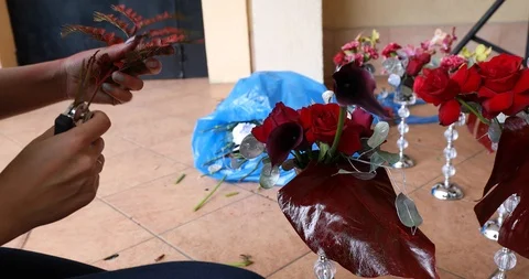 The Florist Completes The Creation Of A Decorative Composition In A Vase With Stock Footage 111789345