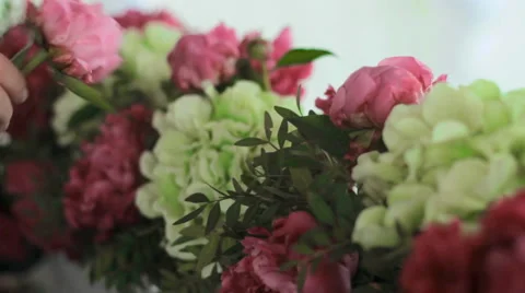 Florist creates decorations of flowers Stock Footage 64120492
