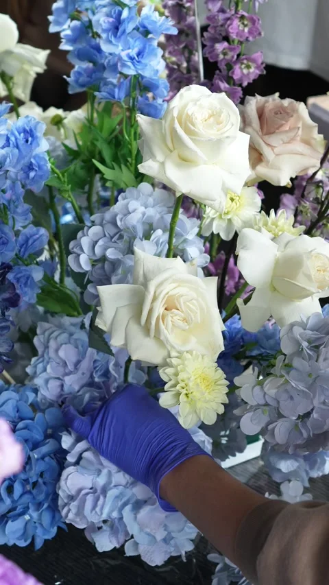 Florist decorator creates romantic wedding flower arrangement near the mirror. P Stock Footage 319045676