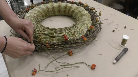 The florist designer makes a wreath composition. Stock Footage 115611257