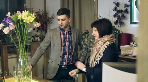 Florist is giving a master class on creating bouquets. Stock Footage 61490082