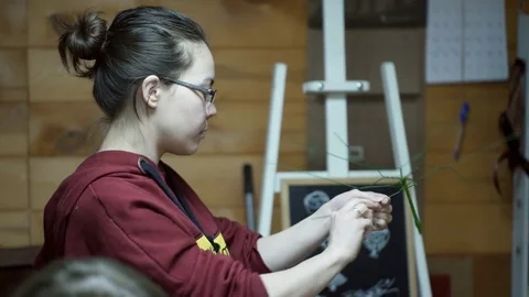 Florist makes basis for flower composition inside decor studio Stock Footage 74072852