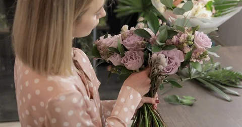 Florist Makes Composition Of Flowers Stock Footage 124576172