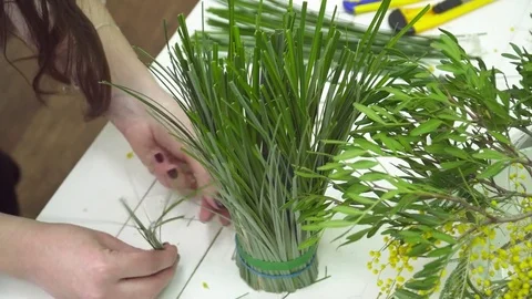 Florist is making a bouquet closeup Video stock 73941008