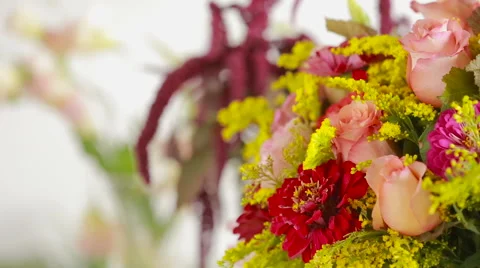 Florist prepares a bouquet of flowers for sale to customers Stock Footage