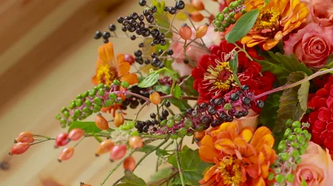 Florist prepares a bouquet of flowers for sale to customers Stock Footage