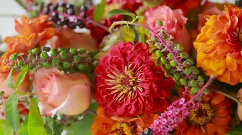 Florist prepares a bouquet of flowers for sale to customers Stock Footage