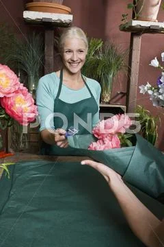 A florist serving a customer Stock Photos