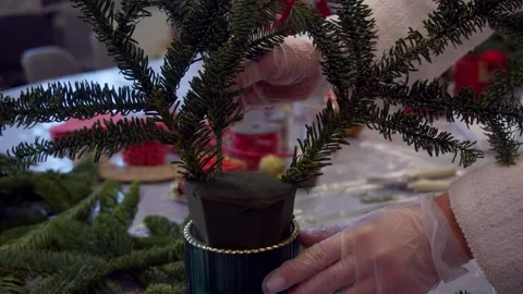 Florist uses branches and sponge to create beautiful Christmas wreath. sponge Stock Footage 316071417