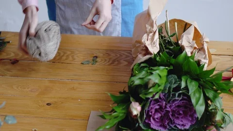 Florist at work: process of creating a floral composition Stock Footage 86829643