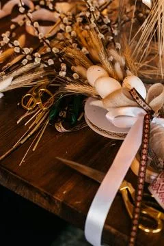 Florist workspace with tools and dried flowers on a wooden table, capturing the Stock Photos