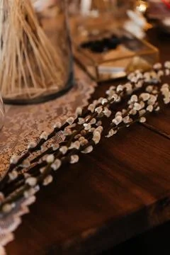 Florist workspace with tools and dried flowers on a wooden table, capturing the Stock Photos