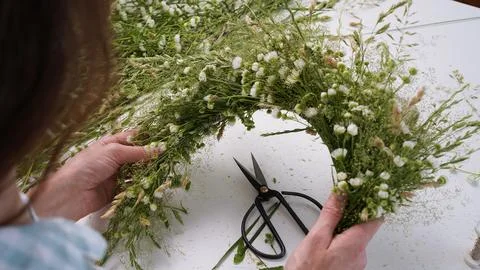 Floristic master class on weaving flower wreath for feast of Ivan Kupala. Stock Photos