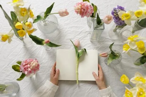 Floristry Flat Lay Workspace with Spring Flowers and Open Notebook Stock Photos