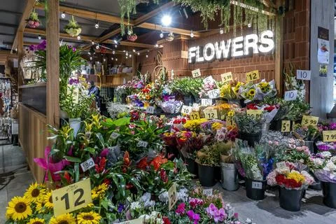 Florist's assorted flower display at front of the store Stock Photos