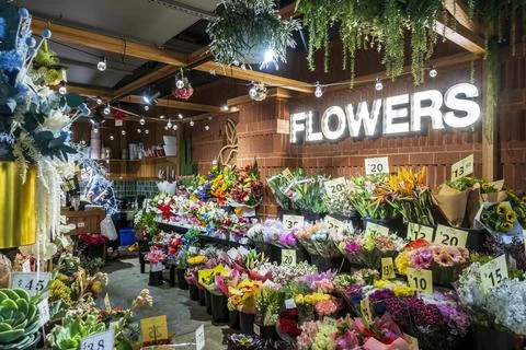 Florist's assorted flower display at front of the store Stock Photos
