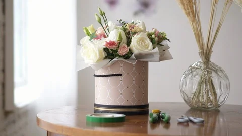 Florist's work desk with tools and bouquets, close-up Stock Footage 104353685