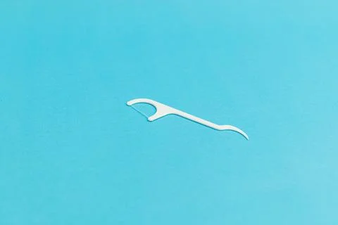 Floss with handle on blue background Stock Photos