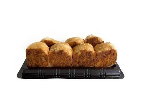 Floss roll bread buns pack on a black plastic tray Stock Photos