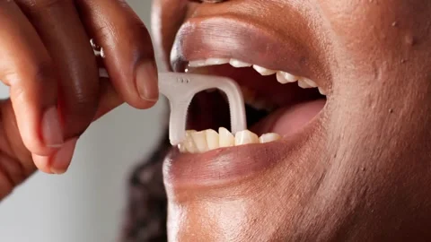 Flossing Teeth With Dental Floss Stick Stock Footage 312470430