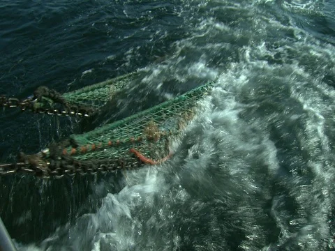 FLOUNDER FISHING TRAWLER STABLIZER PUSH OVERBOARD BY FISHERMAN Stock Footage 76618625