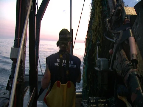 FLOUNDER FISHING TRAWLER STABLIZER PUSH OVERBOARD BY FISHERMAN Stock Footage 76618629