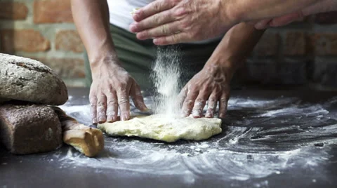 Flour adding to the dough by a man, slow motion at 60 fps Stock Footage 31710314