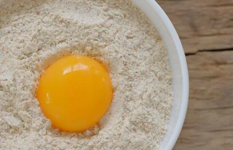 Flour and egg ready for mixing Free Stock Photos
