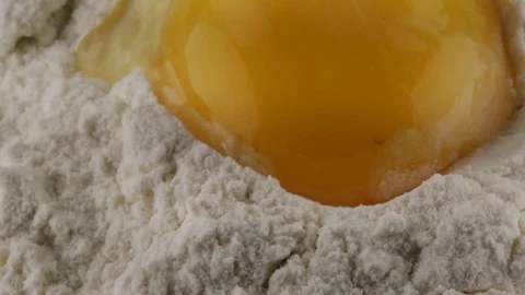 Flour and egg yolk Stock Footage 95876109