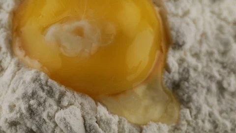 Flour and egg yolk Stock Footage 95876325