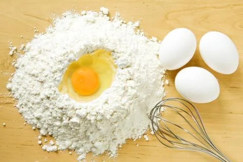 Flour and eggs Stock Photos