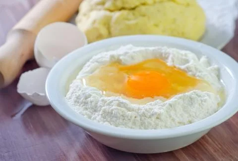 Flour and eggs Stock Photos