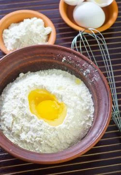 Flour and eggs Stock Photos