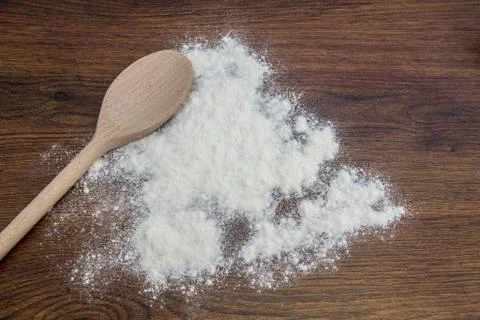 Flour and spoon Stock Photos