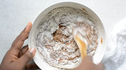 Flour being folded into sugar cookie dough Stock Footage 279157060