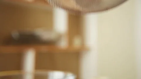 Flour being sieved with strainer Stock Footage 76099498