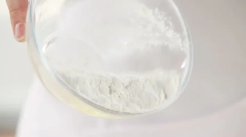 Flour being sprinkled over cooked potatoes Stock Footage 24643301