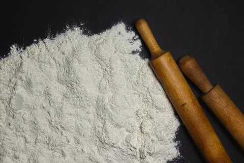 Flour on a black background.  Stock Photos