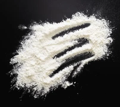 Flour on black Stock Photos