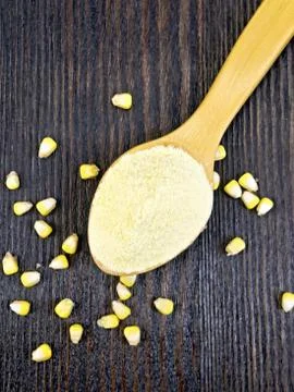 Flour corn in spoon on board top Stock Photos
