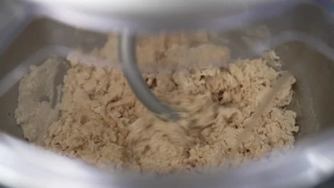 Flour dough (pasta, pizza, bread) kneading machine pouring water slow motion Stock Footage 196168953
