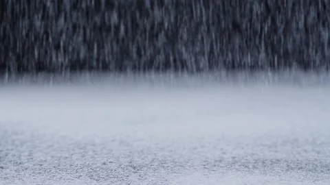 Flour dropping on the kitchen table. Slow motion Video stock 157101448