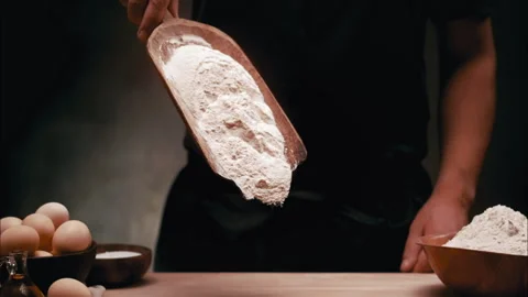 Flour Dropping on the table in slow motion Stock Footage 254930380