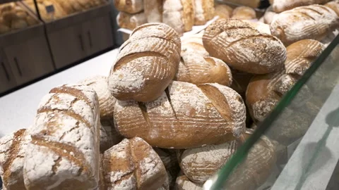 Flour Dusted Artisan Bread Loaves in Food Store Bakery Stock Footage 340042638