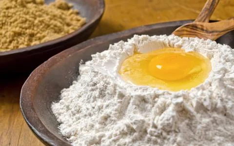 Flour egg well Stock Photos
