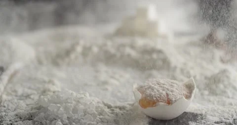 Flour explodes on the table with diffentes ingredients Stock Footage 198004114