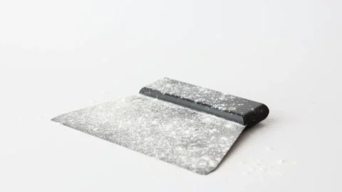 Flour falling on bread dough scraper fast motion Stock Footage 196000209